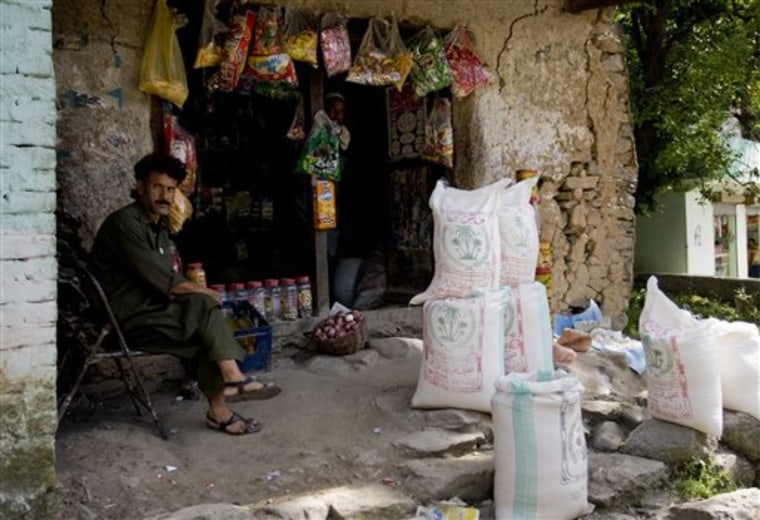 A  Pakistani shopkeeper waits for customers in Guli Badral, Pakistan.